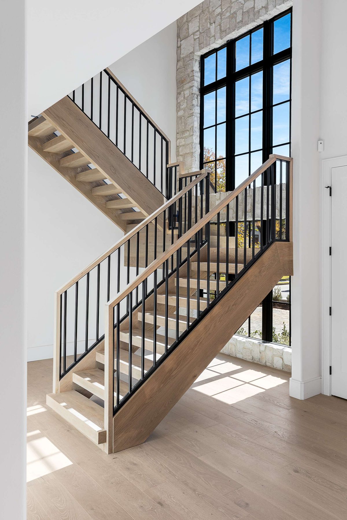 Entry staircase in a Brookhaven custom home built by VIBE
