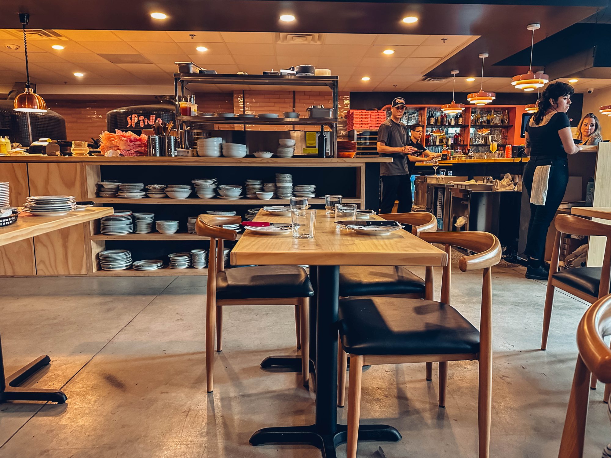Dining room and open kitchen at Spina in Atlanta Dairies